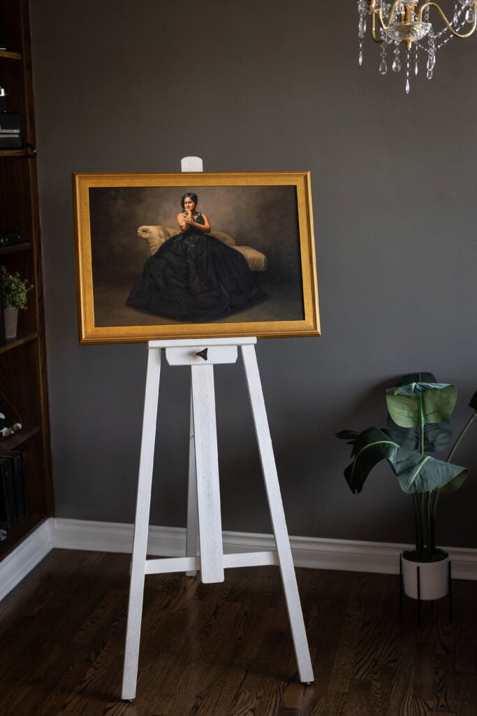 Finished framed portrait artwork displayed on an easel